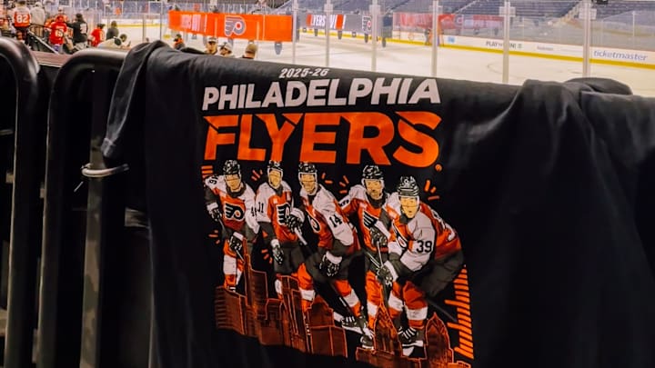 A view of the Flyers opening night shirt laying on a railing 