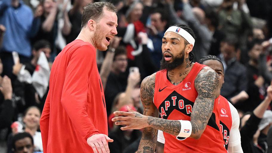 Toronto Raptors forward Brandon Ingram is greeted by center Jakob Poeltl.