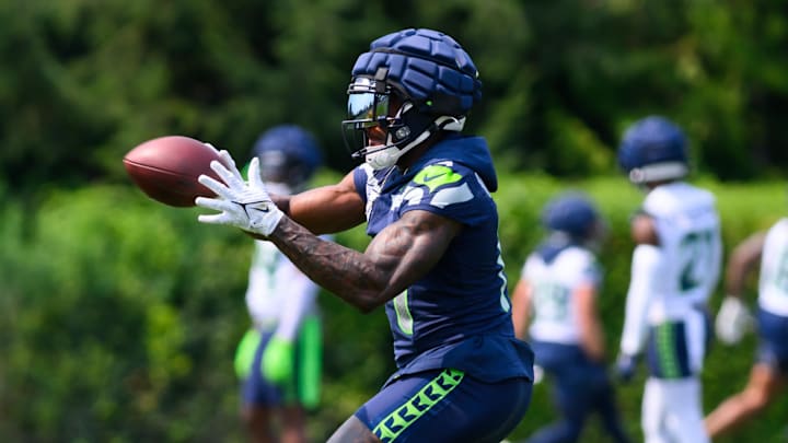 Jul 27, 2024; Renton, WA, USA; Seattle Seahawks wide receiver DK Metcalf (14) catches a pass during training camp at Virginia Mason Athletic Center. Mandatory Credit: Steven Bisig-Imagn Images