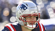 New England Patriots quarterback Drake Maye warms up prior to the game against the Atlanta Falcons.