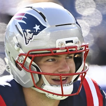 New England Patriots quarterback Drake Maye warms up prior to the game against the Atlanta Falcons.