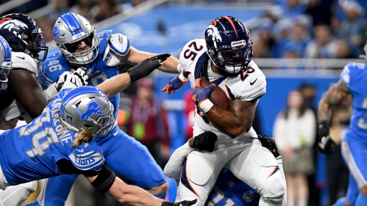 Dec 16, 2023; Detroit, Michigan, USA; Denver Broncos running back Samaje Perine (25) runs the ball against the Detroit Lions in the fourth quarter at Ford Field. Mandatory Credit: Lon Horwedel-USA TODAY Sports