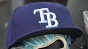 Sep 26, 2025; Toronto, Ontario, CAN; The hat and glove of Tampa Bay Rays third baseman Junior Caminero (13) in the dugout during the game against the Toronto Blue Jays at Rogers Centre. 