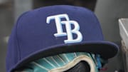 Sep 26, 2025; Toronto, Ontario, CAN; The hat and glove of Tampa Bay Rays third baseman Junior Caminero (13) in the dugout during the game against the Toronto Blue Jays at Rogers Centre. 