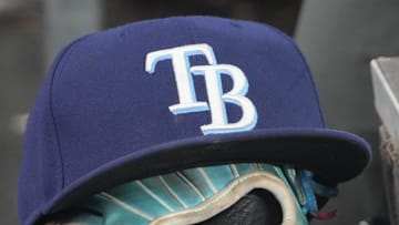 Sep 26, 2025; Toronto, Ontario, CAN; The hat and glove of Tampa Bay Rays third baseman Junior Caminero (13) in the dugout during the game against the Toronto Blue Jays at Rogers Centre. 