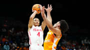 Nov 25, 2025; Las Vegas, NV, USA; Houston Cougars guard Kingston Flemings (4) shoots the ball against Tennessee Volunteers guard Bishop Boswell (3) in a 2025 Players Era Festival group play game during the first half at MGM Grand Garden Arena. Mandatory Credit: Stephen R. Sylvanie-Imagn Images