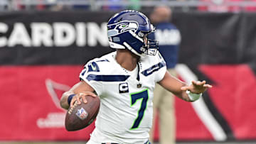 Jan 7, 2024; Glendale, Arizona, USA; Seattle Seahawks quarterback Geno Smith (7) throws in the first half against the Arizona Cardinals at State Farm Stadium. Mandatory Credit: Matt Kartozian-USA TODAY Sports