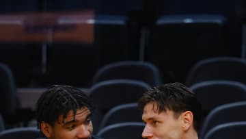 Jul 10, 2024; San Francisco, CA, USA; Miami Heat center Kel'el Ware (7) and guard Pelle Larsson (9) on the bench before a game against the Los Angeles Lakers at Chase Center. Mandatory Credit: Kelley L Cox-USA TODAY Sports