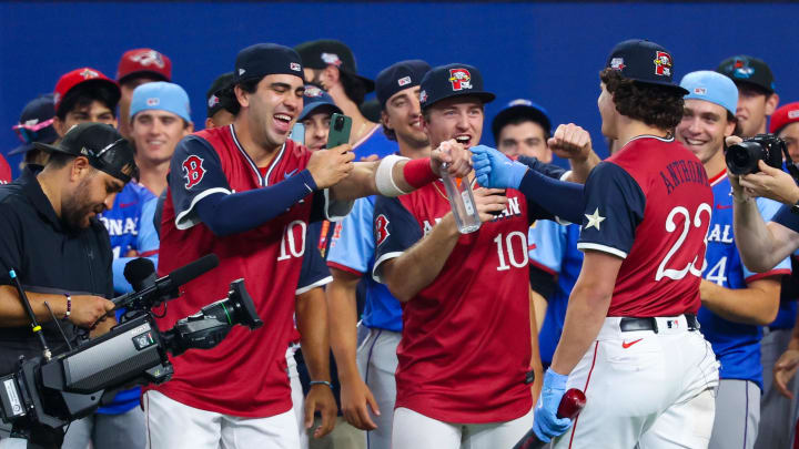 Jul 13, 2024; Arlington, TX, USA;  American League futures outfielder Roman Anthony (23) celebrates with teammates during the Futures Skills Showcase at Globe Life Field.  Mandatory Credit: Kevin Jairaj-USA TODAY Sports