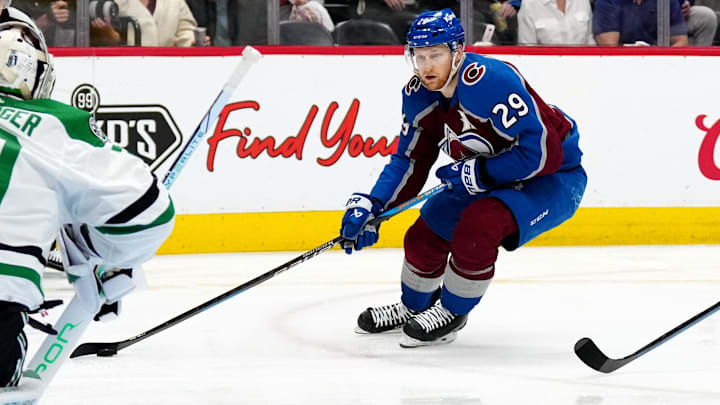 May 17, 2024; Denver, Colorado, USA; Colorado Avalanche center Nathan MacKinnon (29) skates towards Dallas Stars goaltender Jake Oettinger (29) in the second period in game six of the second round of the 2024 Stanley Cup Playoffs at Ball Arena. Mandatory Credit: Ron Chenoy-Imagn Images