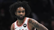 Nov 28, 2025; Charlotte, North Carolina, USA; Chicago Bulls guard Coby White (0) reacts after scoring during the second half against the Charlotte Hornets at the Spectrum Center. Mandatory Credit: Sam Sharpe-Imagn Images