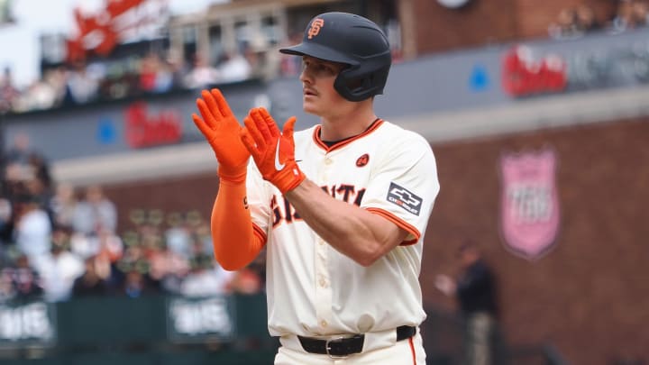 Aug 11, 2024; San Francisco, California, USA;  San Francisco Giants third baseman Matt Chapman (26) claps from first base after hitting an RBI single against the Detroit Tigers during the sixth inning at Oracle Park.