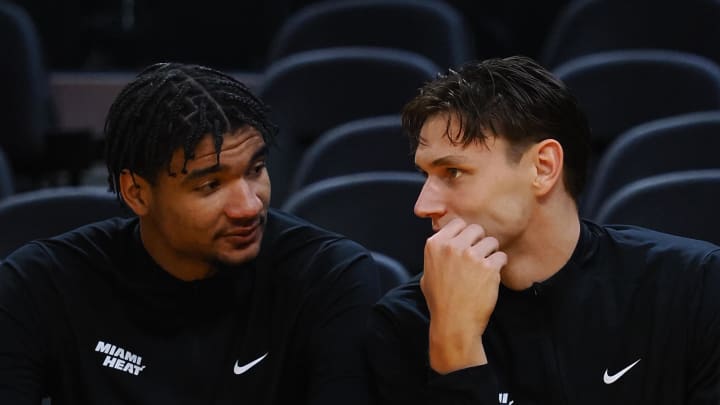 Jul 10, 2024; San Francisco, CA, USA; Miami Heat center Kel'el Ware (7) and guard Pelle Larsson (9) on the bench before a game against the Los Angeles Lakers at Chase Center. Mandatory Credit: Kelley L Cox-USA TODAY Sports