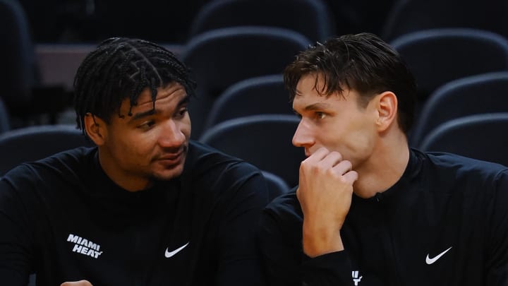 Jul 10, 2024; San Francisco, CA, USA; Miami Heat center Kel'el Ware (7) and guard Pelle Larsson (9) on the bench before a game against the Los Angeles Lakers at Chase Center. Mandatory Credit: Kelley L Cox-USA TODAY Sports