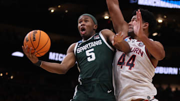 Mar 30, 2025; Atlanta, GA, USA; Michigan State Spartans guard Tre Holloman (5) shoots against Auburn Tigers center Dylan Cardwell (44) during the second half in the South Regional final of the 2025 NCAA tournament at State Farm Arena. Mandatory Credit: Brett Davis-Imagn Images