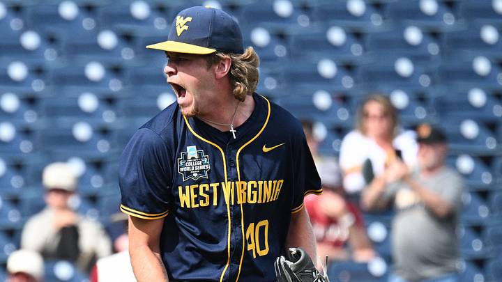 Jun 16, 2026; Omaha, NE, USA;  West Virginia Mountaineers pitcher Carson Estridge (40) celebrates the win against the Troy Trojans at Charles Schwab Field. Mandatory Credit: Steven Branscombe-Imagn Images