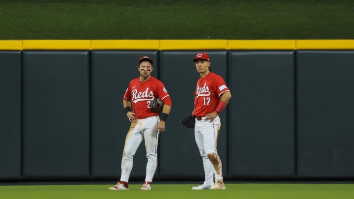 Jun 11, 2024; Cincinnati, Ohio, USA; Cincinnati Reds outfielder TJ Friedl (29) and outfielder Stuart Fairchild (17) stand on the field during a stop in play in the seventh inning against the Cleveland Guardians at Great American Ball Park. Mandatory Credit: Katie Stratman-USA TODAY Sports