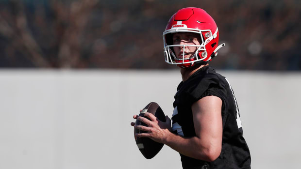 Georgia quarterback Carson Beck (15) looks to throw during spring practice in Athens, Ga., on