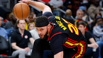 Larry Nance Jr. #22 of the Atlanta Hawks dribbles against the Miami Heat.
