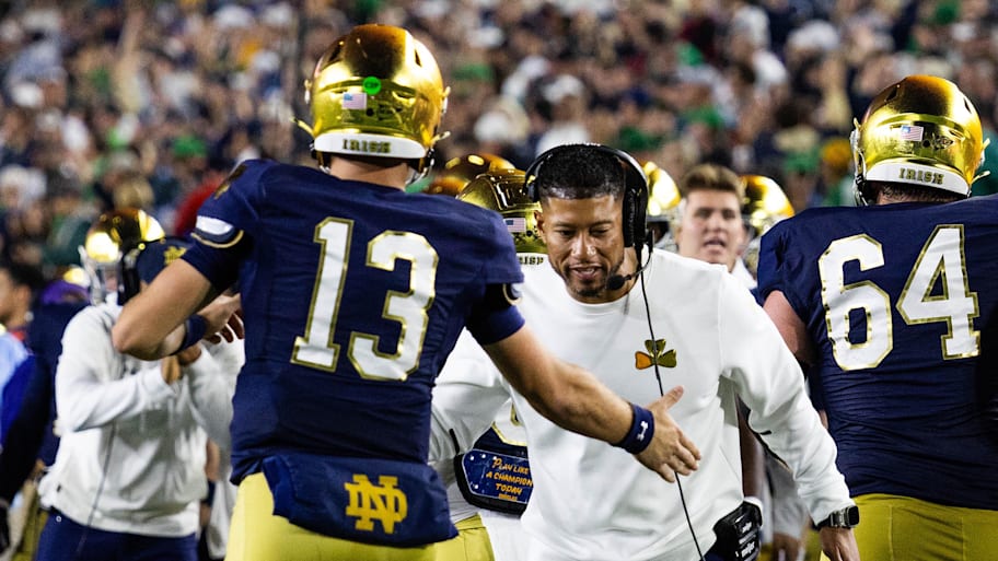 Notre Dame coach Marcus Freeman celebrates with quarterback CJ Carr.