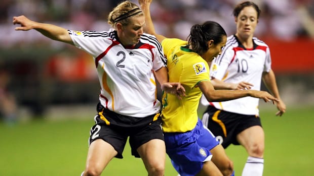 Brazil forward Marta and Germany defender Kerstin Stegemann battle for the ball.