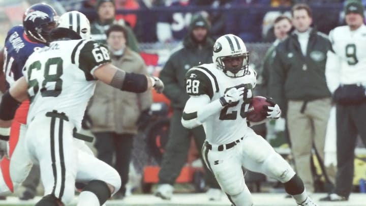 New York Jets Curtis Martin (28) looks fro some running room in the Broncos defense during the AFC Championship game at Mile High Stadium in Denver Jan 17, 1999. Denver won the game 23-10