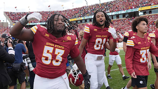 Iowa State Cyclones football players celebrating after a win