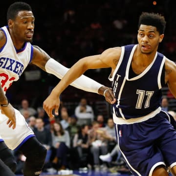 Dec 5, 2014; Philadelphia, PA, USA; Oklahoma City Thunder guard Jeremy Lamb (11) dribbles the ball past Philadelphia 76ers forward Robert Covington (33) during the second half at Wells Fargo Center. The Thunder defeated the 76ers 103-91. Mandatory Credit: Bill Streicher-USA TODAY Sports