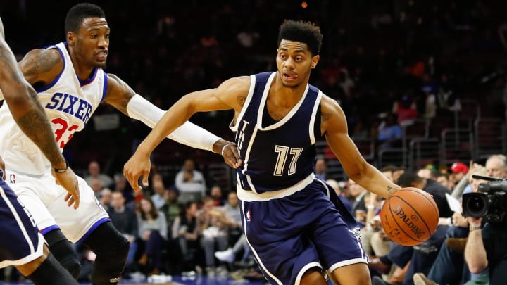 Dec 5, 2014; Philadelphia, PA, USA; Oklahoma City Thunder guard Jeremy Lamb (11) dribbles the ball past Philadelphia 76ers forward Robert Covington (33) during the second half at Wells Fargo Center. The Thunder defeated the 76ers 103-91. Mandatory Credit: Bill Streicher-USA TODAY Sports