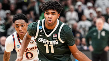 Michigan State guard Jase Richardson drives to the basket against Auburn guard Tahaad Pettiford during the first half of the Elite Eight round of the NCAA tournament at State Farm Arena in Atlanta on Sunday, March 30, 2025.