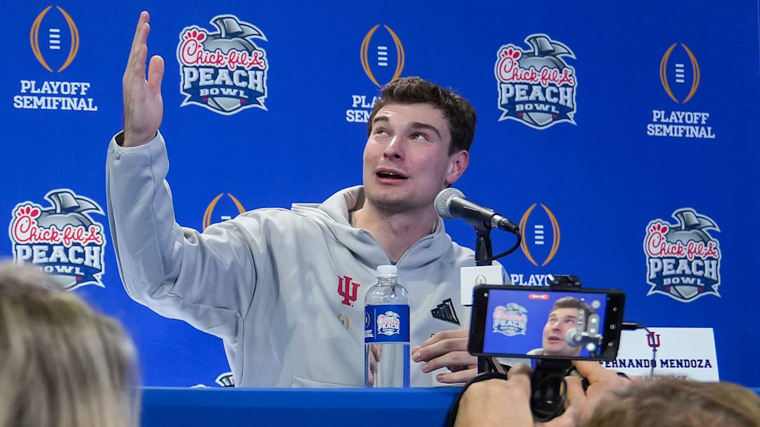Indiana Hoosiers quarterback Fernando Mendoza (15) answers questions Wednesday, Jan. 7, 2026, during media day ahead of the College football Playoff Peach Bowl game against the Oregon Ducks at Mercedes-Benz Stadium in Atlanta.