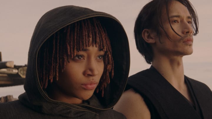 (L-R): Osha Aniseya (Amandla Stenberg) and the Stranger Qimir (Manny Jacinto) in Lucasfilm's Star Wars: THE ACOLYTE, season one, exclusively on Disney+. ©2024 Lucasfilm Ltd. & TM. All Rights Reserved.