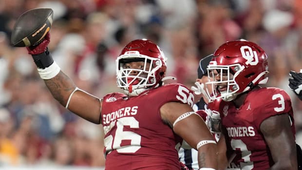 Oklahoma Sooners defensive lineman Gracen Halton (56) celebrates beside defensive back Robert Spears-Jennings (3).
