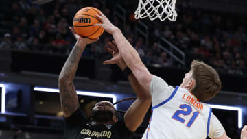 Mar 22, 2024; Indianapolis, IN, USA; Colorado Buffaloes center Eddie Lampkin Jr. (44) shoots against Florida Gators forward Alex Condon (21) in the second half in the first round of the 2024 NCAA Tournament at Gainbridge FieldHouse. Mandatory Credit: Trevor Ruszkowski-USA TODAY Sports