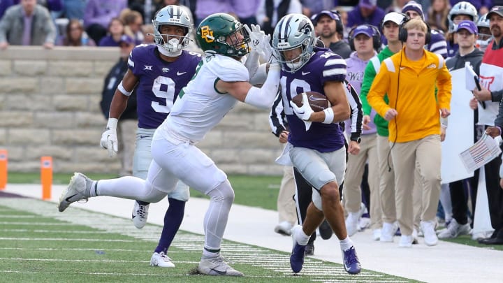 Nov 11, 2023; Manhattan, Kansas, USA; Kansas State Wildcats wide receiver Keagan Johnson (10) is pushed out of bounds by the Baylor defense.