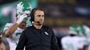 North Texas Mean Green head coach Eric Morris walks on the field during the game against Texas State.