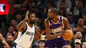 Kevin Durant guarded by Kyrie Irving during a December matchup between the Mavericks and Suns.