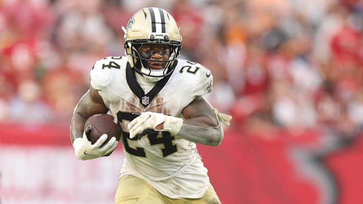 Dec 7, 2025; Tampa, Florida, USA; New Orleans Saints running back Devin Neal (24) runs for a gain during the fourth quarter against the Tampa Bay Buccaneers at Raymond James Stadium. Mandatory Credit: Nathan Ray Seebeck-Imagn Images