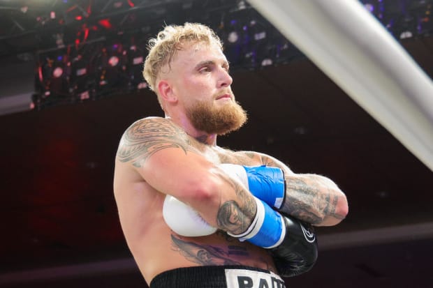 Dec 15, 2023; Orlando, Florida, USA;  Jake Paul reacts after knocking out Andre August in the first round at Caribe Royale Orlando. Mandatory Credit: Nathan Ray Seebeck-USA TODAY Sports