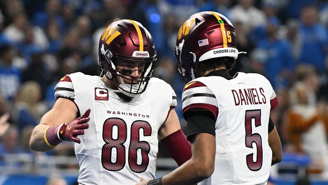 Jan 18, 2025; Detroit, Michigan, USA; Washington Commanders tight end Zach Ertz (86) celebrates touchdown pass with quarterback Jayden Daniels (5) during the second quarter in a 2025 NFC divisional round game at Ford Field. Mandatory Credit: Lon Horwedel-Imagn Images