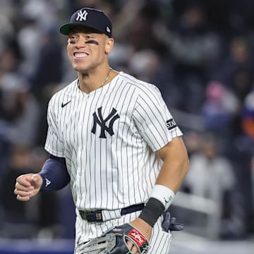Bronx, New York, USA;  New York Yankees right fielder Aaron Judge (99) reacts after defeating the Kansas City Royals 4-2 at Yankee Stadium. All players wore #42 for Jackie Robinson Day.  Mandatory Credit: Wendell Cruz-Imagn Images