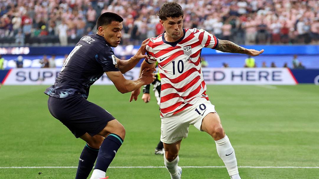  June 12, 2026; Inglewood, California, U.S.; Christian Pulisic of the U.S. in action with Paraguay's Diego Gomez.  Mandatory Credit: Kiyoshi Mio-Imagn Images 