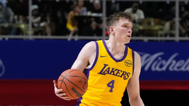 Jul 12, 2024; Las Vegas, NV, USA; Los Angeles Lakers forward Dalton Knecht (4) dribbles the ball against the Houston Rockets during the second half at Thomas & Mack Center. Mandatory Credit: Lucas Peltier-USA TODAY Sports