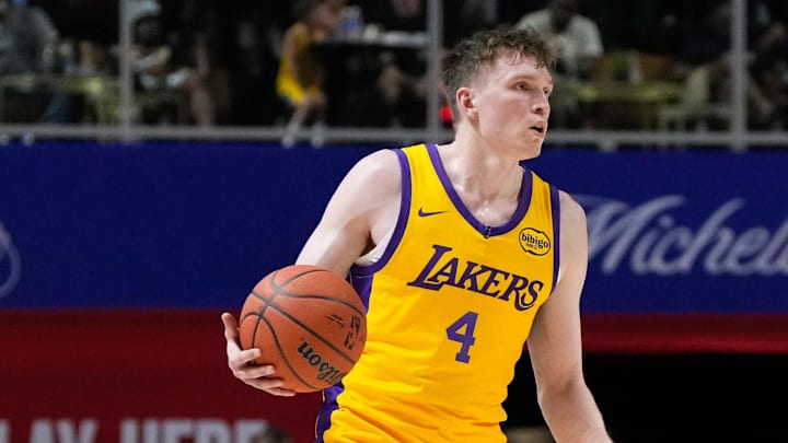 Jul 12, 2024; Las Vegas, NV, USA; Los Angeles Lakers forward Dalton Knecht (4) dribbles the ball against the Houston Rockets during the second half at Thomas & Mack Center. Mandatory Credit: Lucas Peltier-Imagn Images