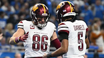 Jan 18, 2025; Detroit, Michigan, USA; Washington Commanders tight end Zach Ertz (86) celebrates touchdown pass with quarterback Jayden Daniels (5) during the second quarter in a 2025 NFC divisional round game at Ford Field. Mandatory Credit: Lon Horwedel-Imagn Images