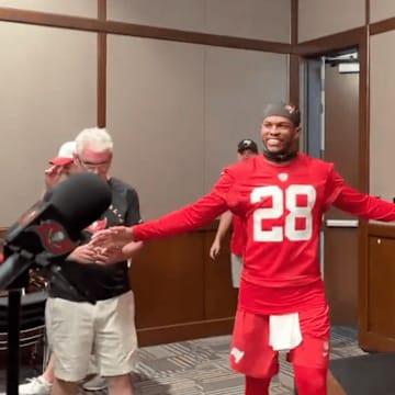 Shilo Sanders enters a press conference at Buccaneers rookie minicamp
