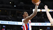 Dec 28, 2024; Denver, Colorado, USA; Detroit Pistons forward Ronald Holland II (00) shoots the ball over Denver Nuggets guard Christian Braun (0) in the second half at Ball Arena. Mandatory Credit: Ron Chenoy-Imagn Images