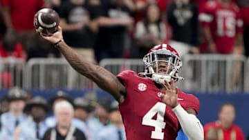 Dec 2, 2023; Atlanta, GA, USA;  Alabama Crimson Tide quarterback Jalen Milroe (4) throws against Georgia at Mercedes-Benz Stadium. Milroe was named the MVP. Alabama defeated Georgia 27-24 to claim the SEC Championship. Mandatory Credit: Gary Cosby Jr.-Imagn Images