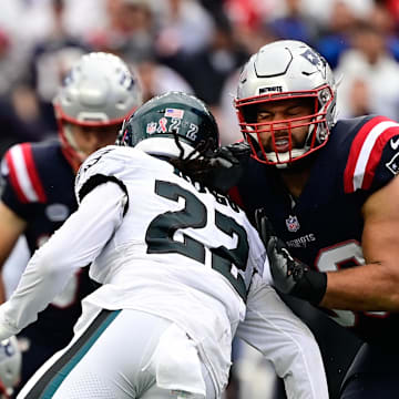 Sep 10, 2023; Foxborough, Massachusetts, USA; New England Patriots defensive end Lawrence Guy Sr. (93) blocks Philadelphia Eagles conner back Kelee Ringo (22) during the first half at Gillette Stadium. Mandatory Credit: Eric Canha-Imagn Images