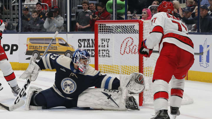 Apr 16, 2024; Columbus, Ohio, USA; Columbus Blue Jackets goalie Jet Greaves (73) makes a save on a shot by Carolina Hurricanes defenseman Tony DeAngelo (77) during the third period at Nationwide Arena. Mandatory Credit: Russell LaBounty-USA TODAY Sports